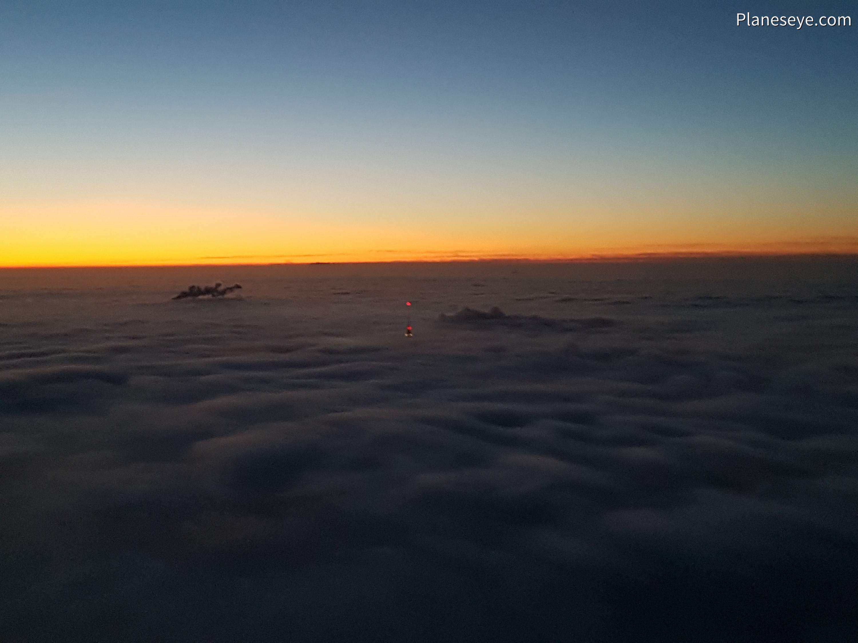 Berlin TV Tower breaching the clouds during dusk
